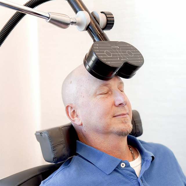 Man receiving TMS as part of MeRT treatment