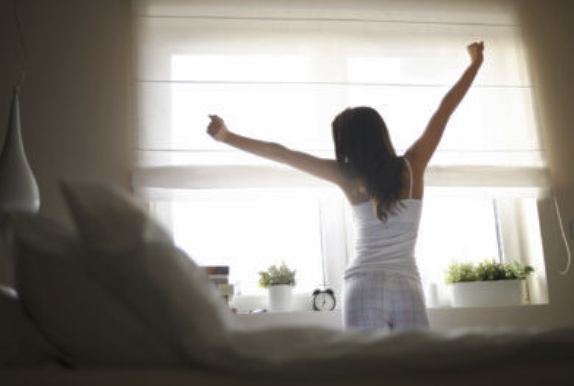 woman waking up after restful sleep